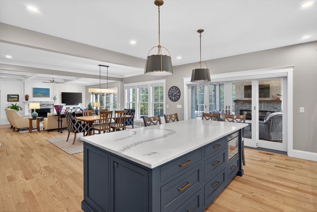 12 Talcott Pines Road Plymouth, MA 02360 - Photo 21 of 41 a view of living room and kitchen with furniture and wooden floor