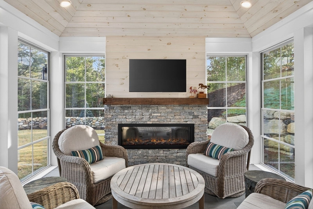 12 Talcott Pines Road Plymouth, MA 02360 - Photo 22 of 41 a living room with furniture a fireplace and window