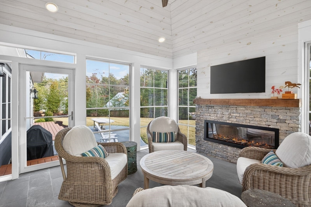 12 Talcott Pines Road Plymouth, MA 02360 - Photo 23 of 41 a living room with furniture fireplace and a flat screen tv