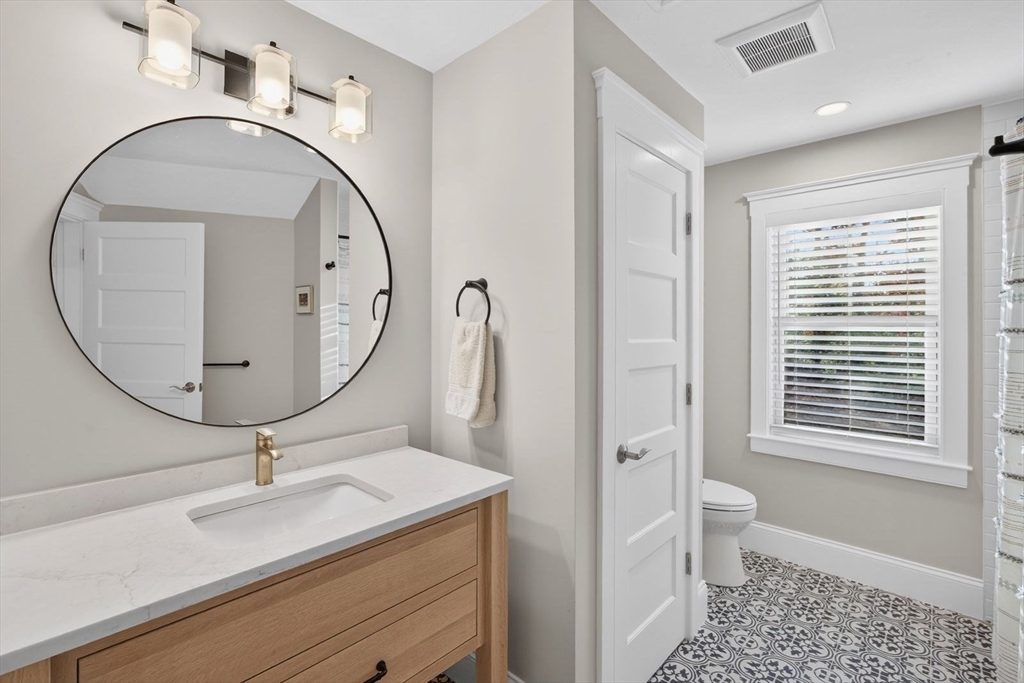 12 Talcott Pines Road Plymouth, MA 02360 - Photo 31 of 41 a bathroom with a sink a toilet and a mirror