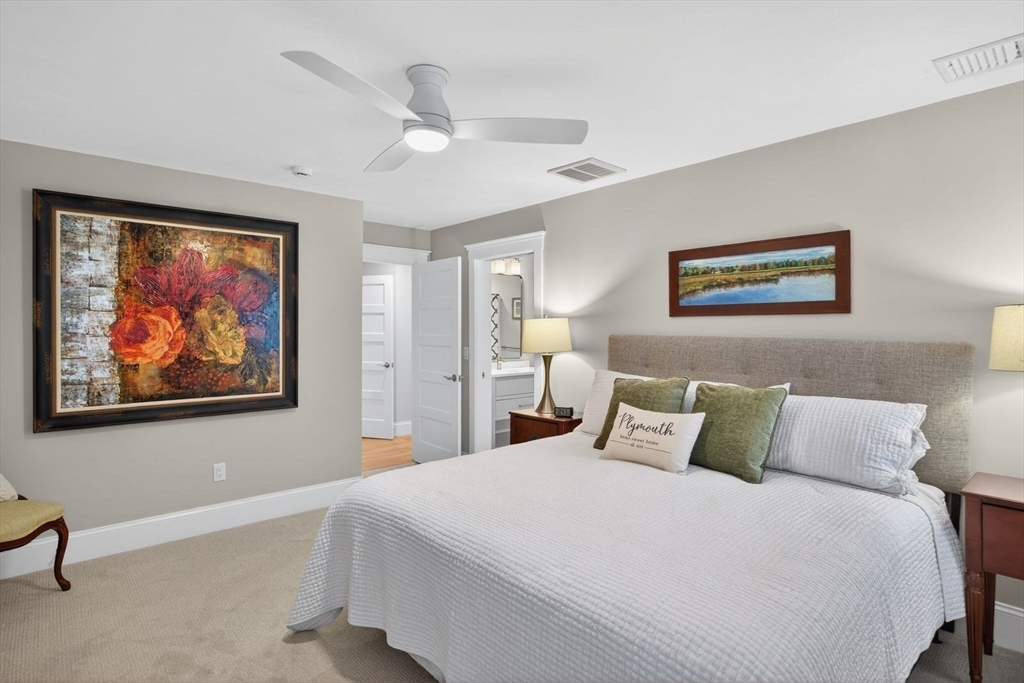 12 Talcott Pines Road Plymouth, MA 02360 - Photo 32 of 41 a bedroom with a large bed and a painting on the wall