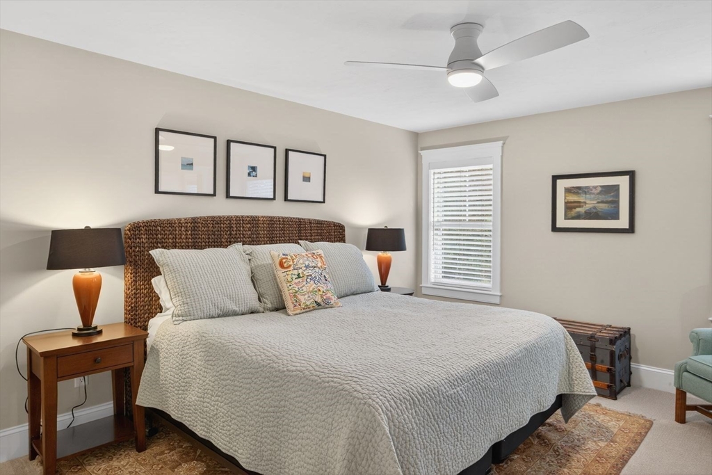 12 Talcott Pines Road Plymouth, MA 02360 - Photo 34 of 41 a bedroom with a bed and wooden floor