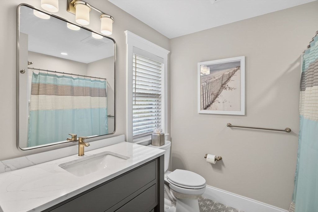 12 Talcott Pines Road Plymouth, MA 02360 - Photo 36 of 41 a bathroom with a sink toilet and a mirror