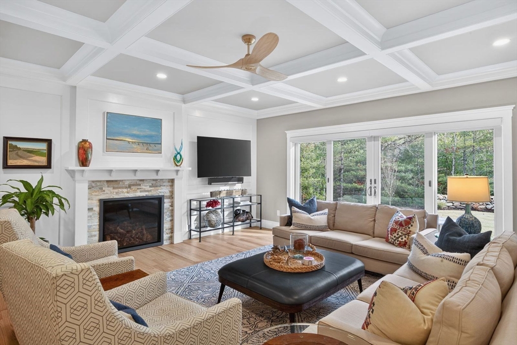 12 Talcott Pines Road Plymouth, MA 02360 - Photo 8 of 41 a living room with furniture a fireplace and a large window
