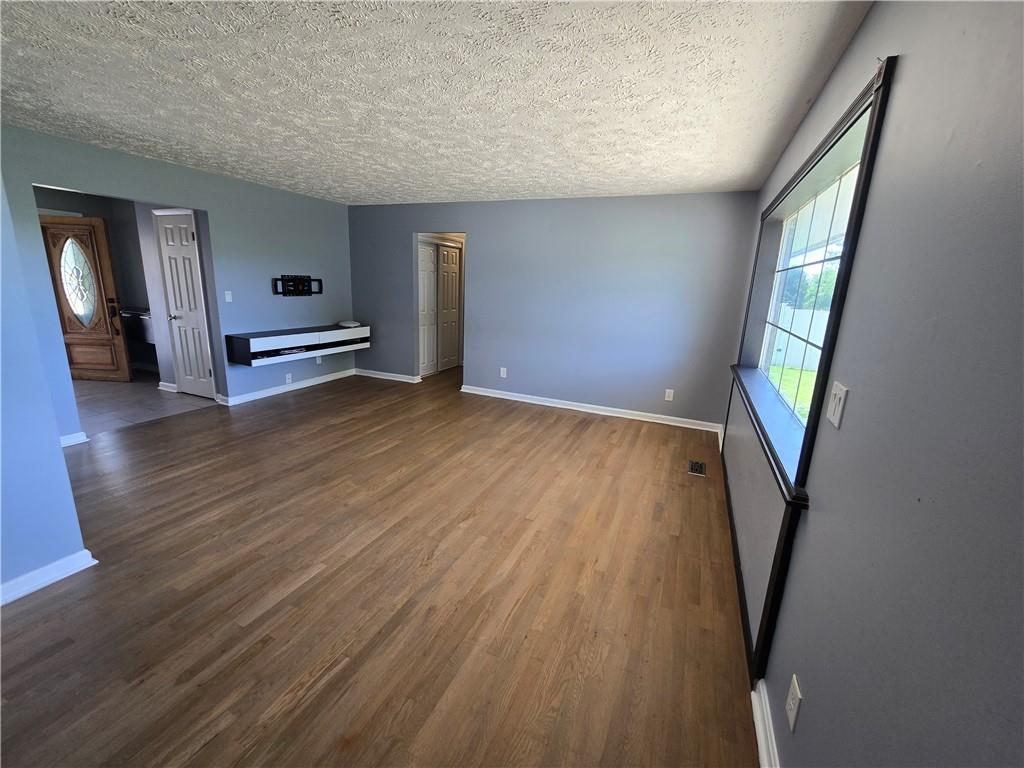 740 South Keel Ridge Road Hermitage, PA 16148 - Photo 7 of 33 a view of a livingroom with wooden floor and stairs