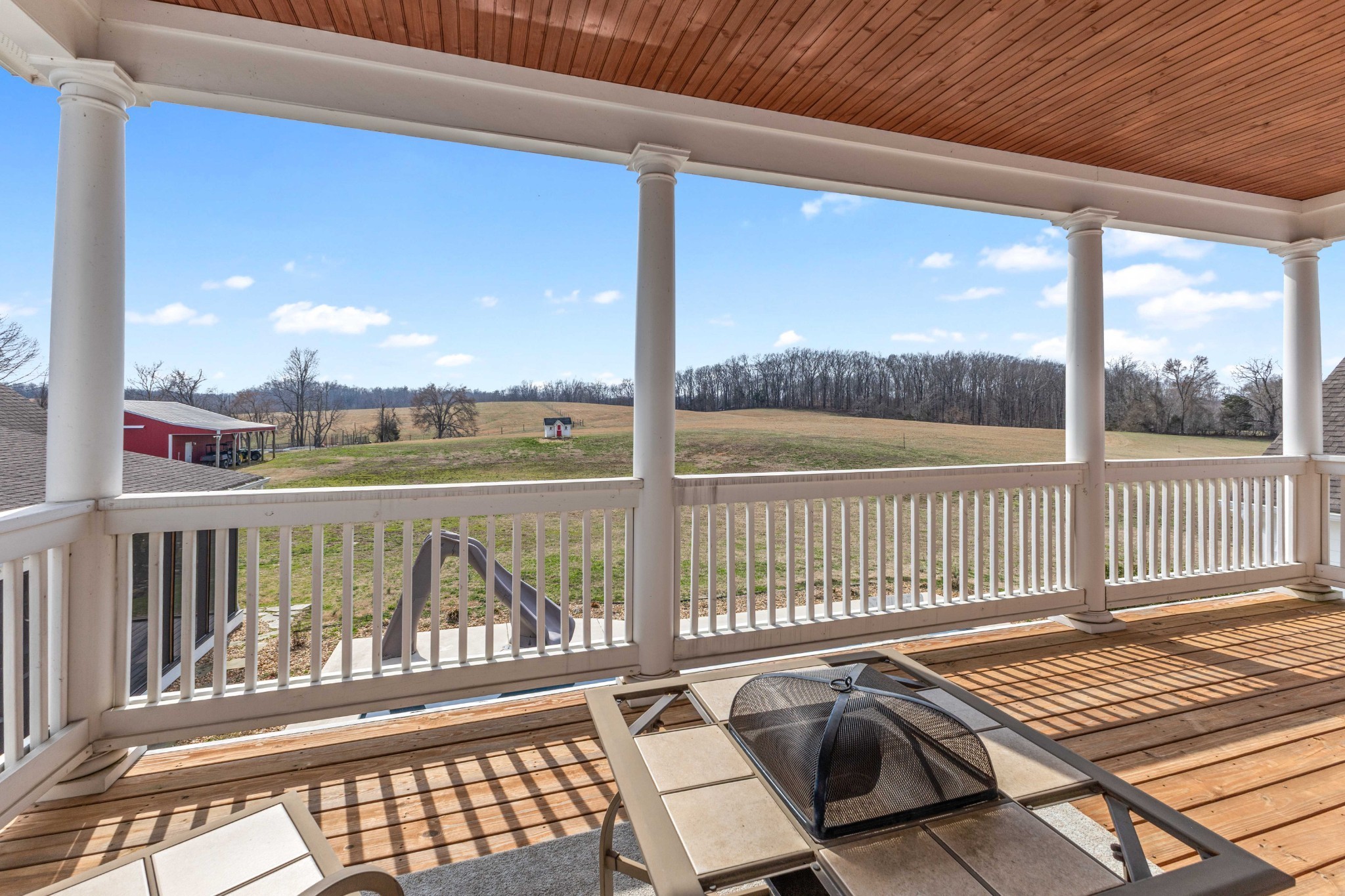 1103 Rogues Fork Road Bethpage, TN 37022 - Photo 61 of 100 a view of a balcony with wooden floor next to a yard