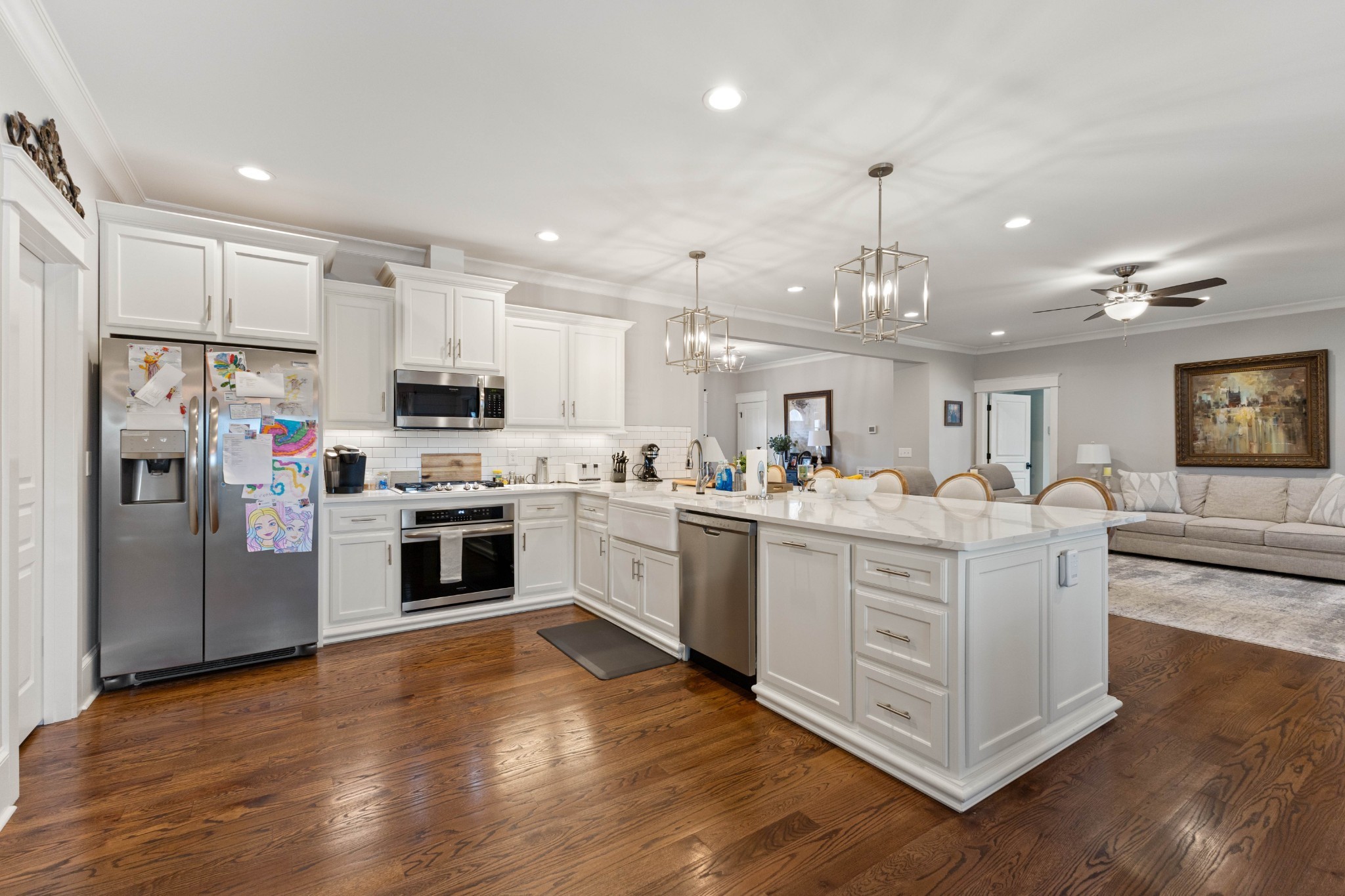 1103 Rogues Fork Road Bethpage, TN 37022 - Photo 79 of 100 a large white kitchen with cabinets a sink a window and stainless steel appliances