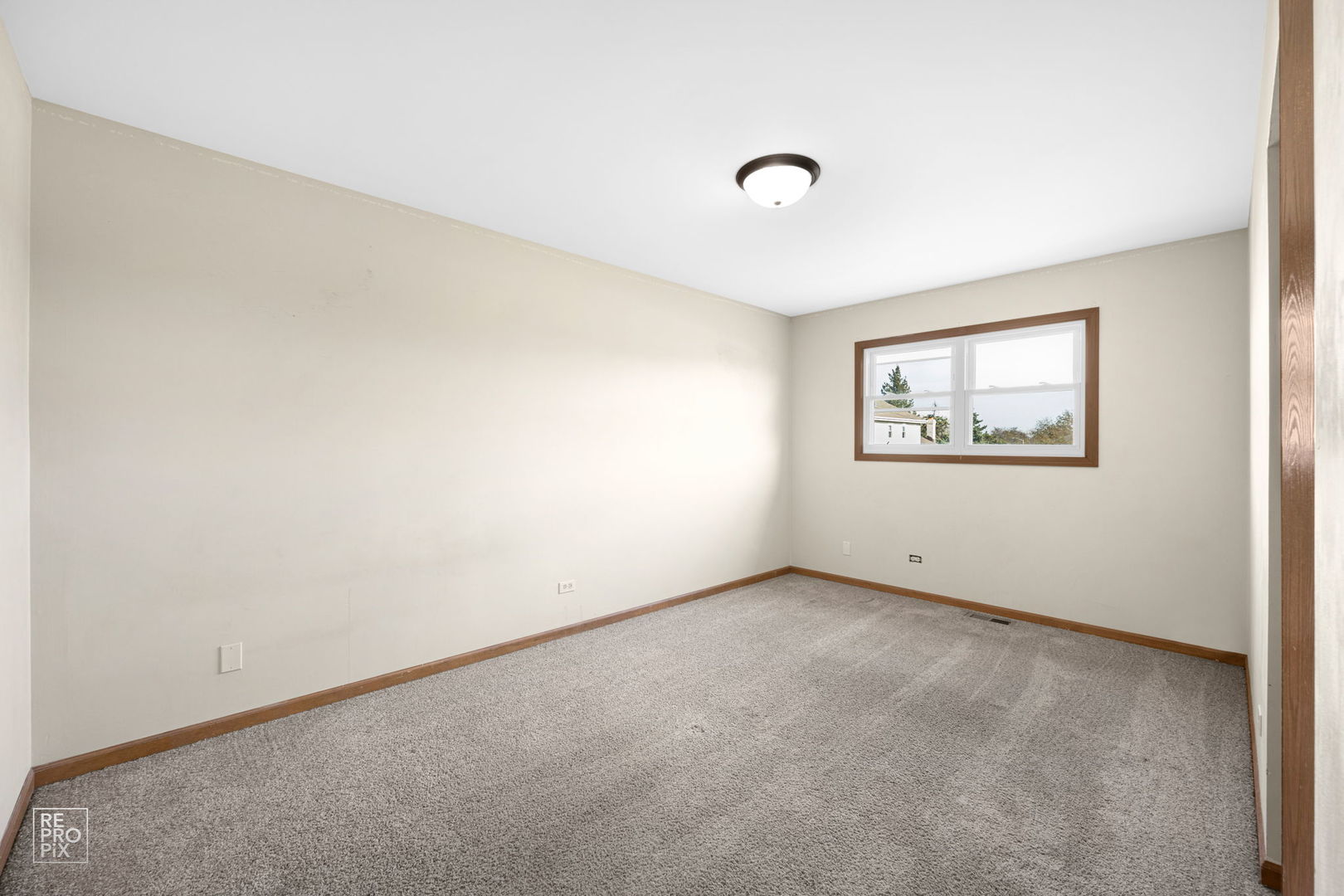 309 Wheatfield Road Matteson, IL 60443 - Photo 18 of 22 an empty room with windows