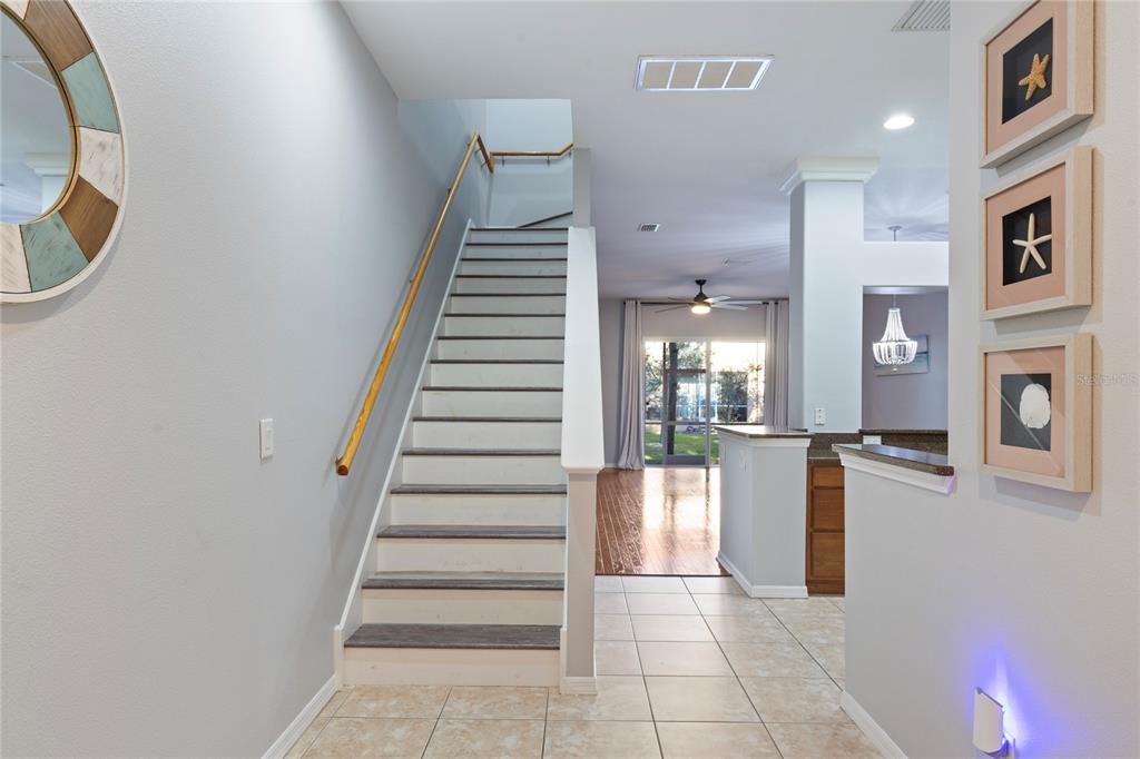 1455 Hidden Court Tarpon Springs, FL 34689 - Photo 13 of 30 a view of entryway and hall with wooden floor