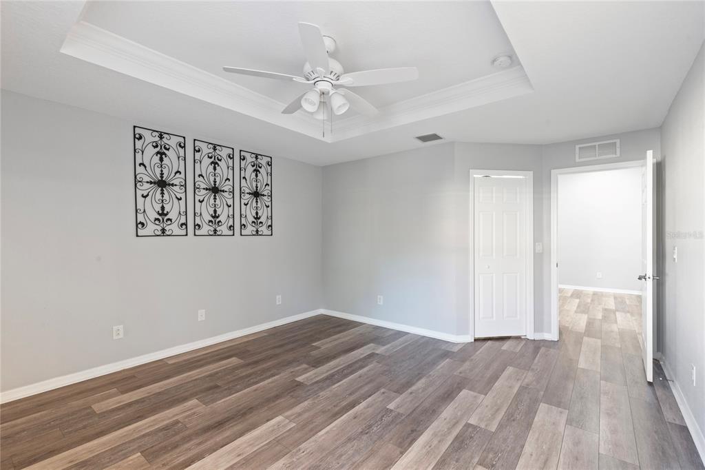 1455 Hidden Court Tarpon Springs, FL 34689 - Photo 19 of 30 wooden floor in an empty room with a window