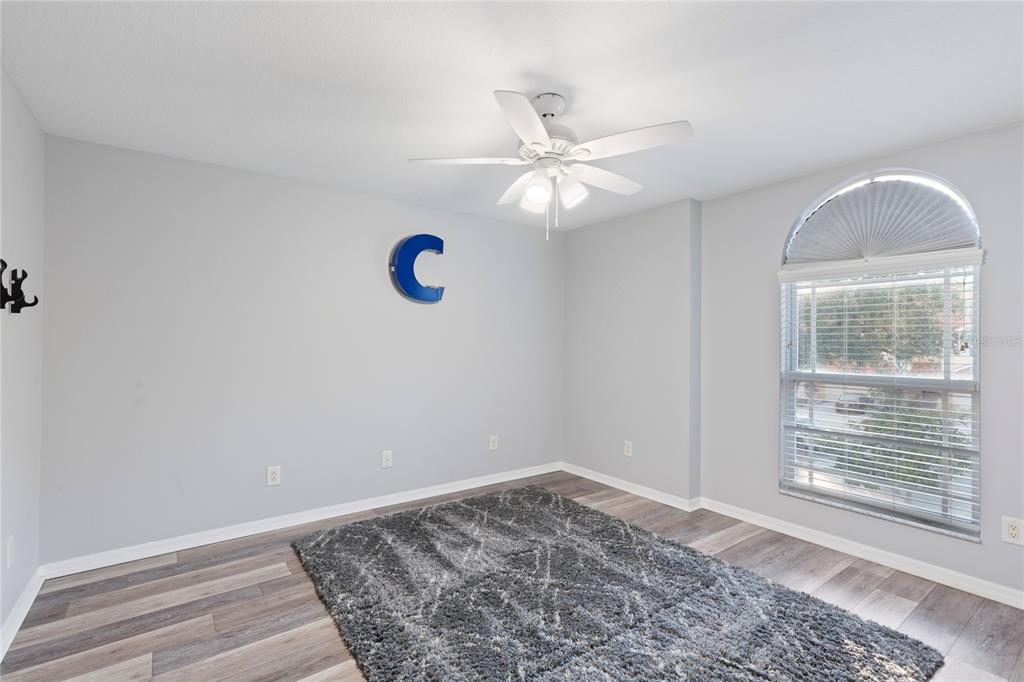 1455 Hidden Court Tarpon Springs, FL 34689 - Photo 26 of 30 a view of a room with a ceiling fan and a window