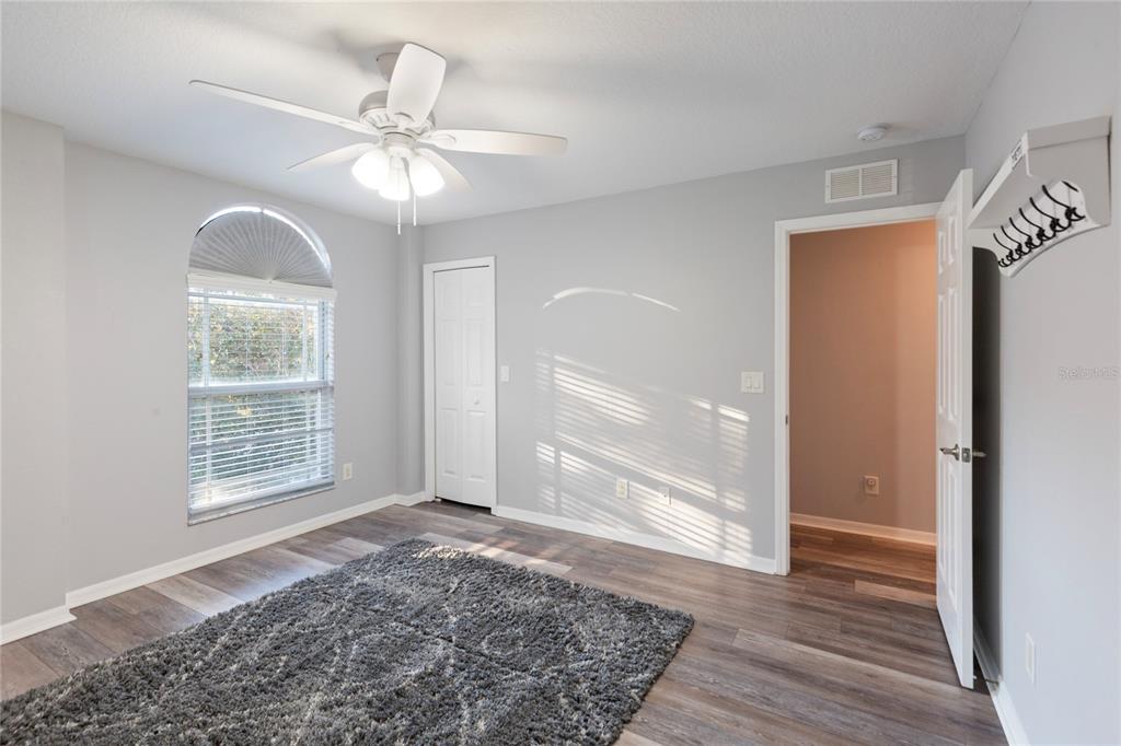 1455 Hidden Court Tarpon Springs, FL 34689 - Photo 27 of 30 wooden floor in an empty room with a window