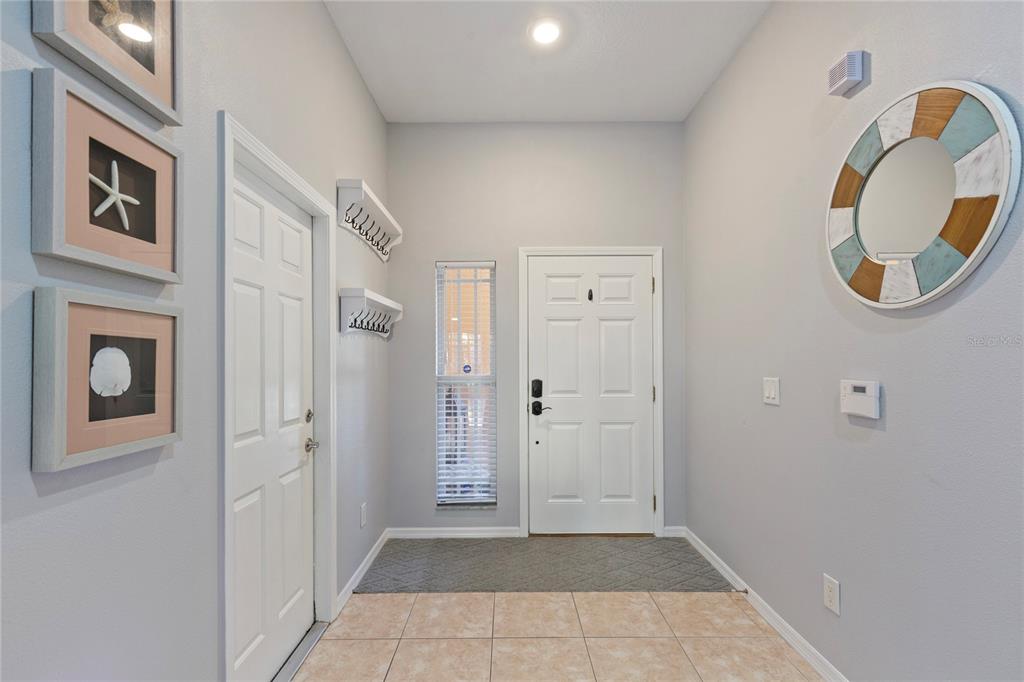 1455 Hidden Court Tarpon Springs, FL 34689 - Photo 29 of 30 a view of an entryway with wooden floor
