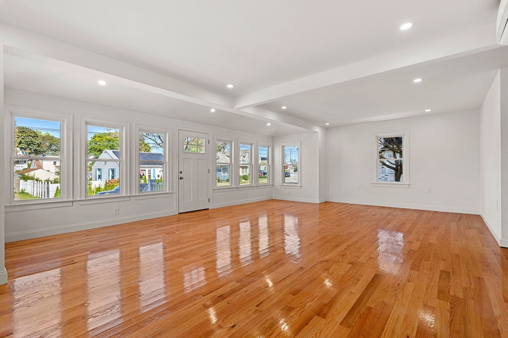 29 Willson Street Salem, MA 01970 - Photo 11 of 41 a view of an empty room with wooden floor and a window