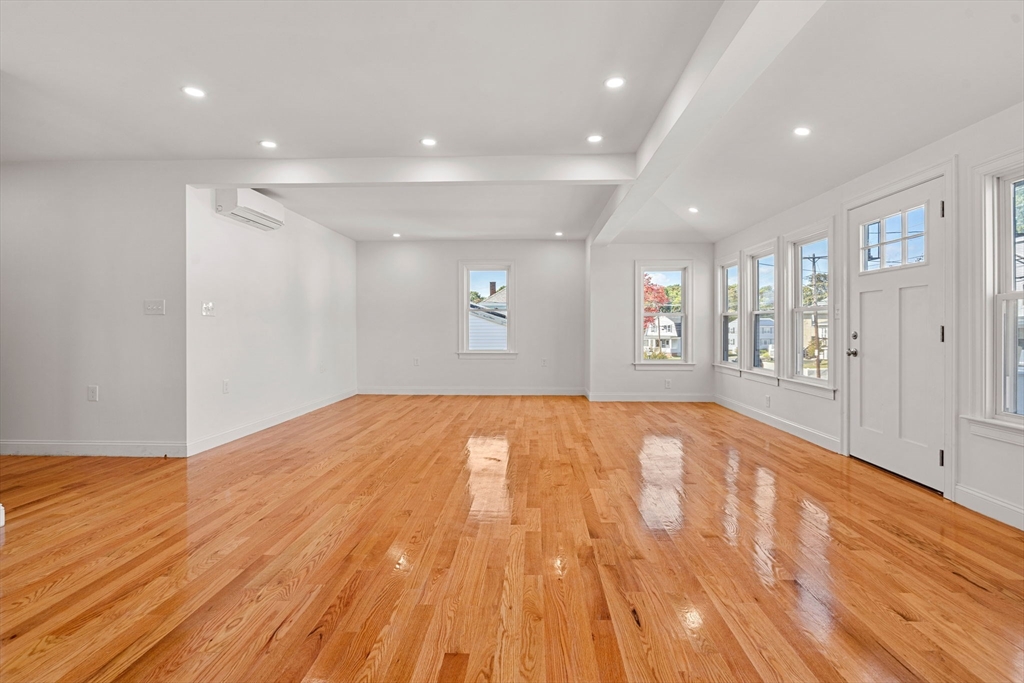 29 Willson Street Salem, MA 01970 - Photo 13 of 41 a view of an empty room with wooden floor and a window