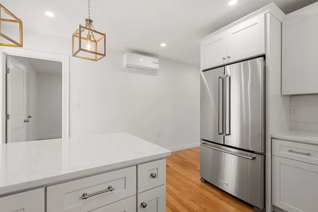 a white refrigerator freezer sitting inside of a kitchen