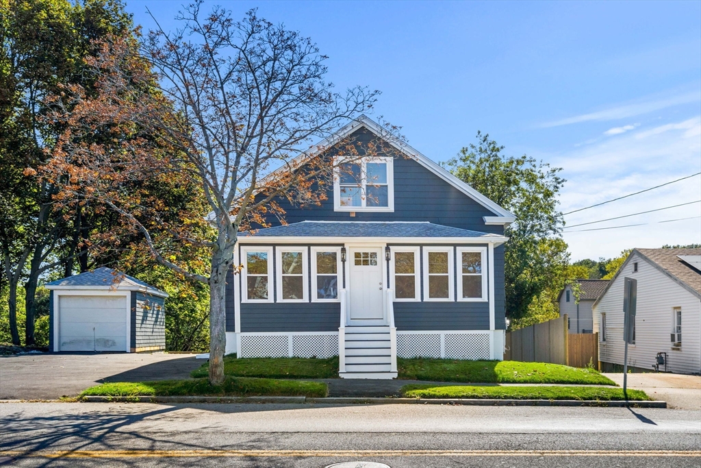 29 Willson Street Salem, MA 01970 - Photo 2 of 41 a front view of a house with a yard and garage
