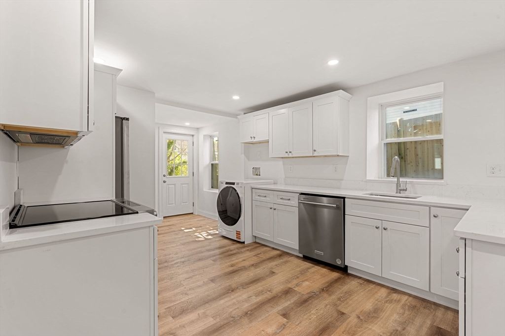29 Willson Street Salem, MA 01970 - Photo 25 of 41 a kitchen with a stove a sink and a refrigerator