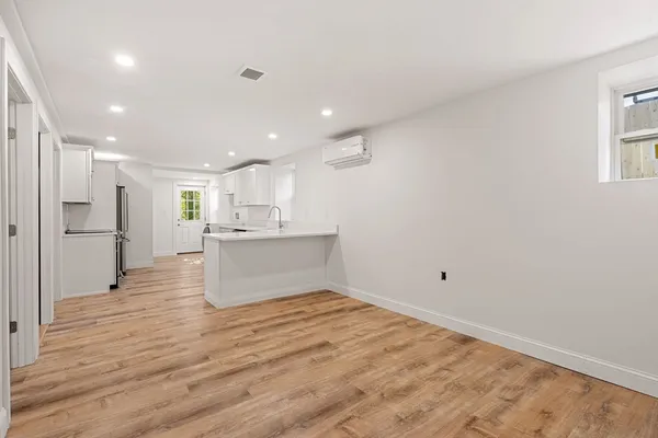 a view of kitchen view wooden floor and window