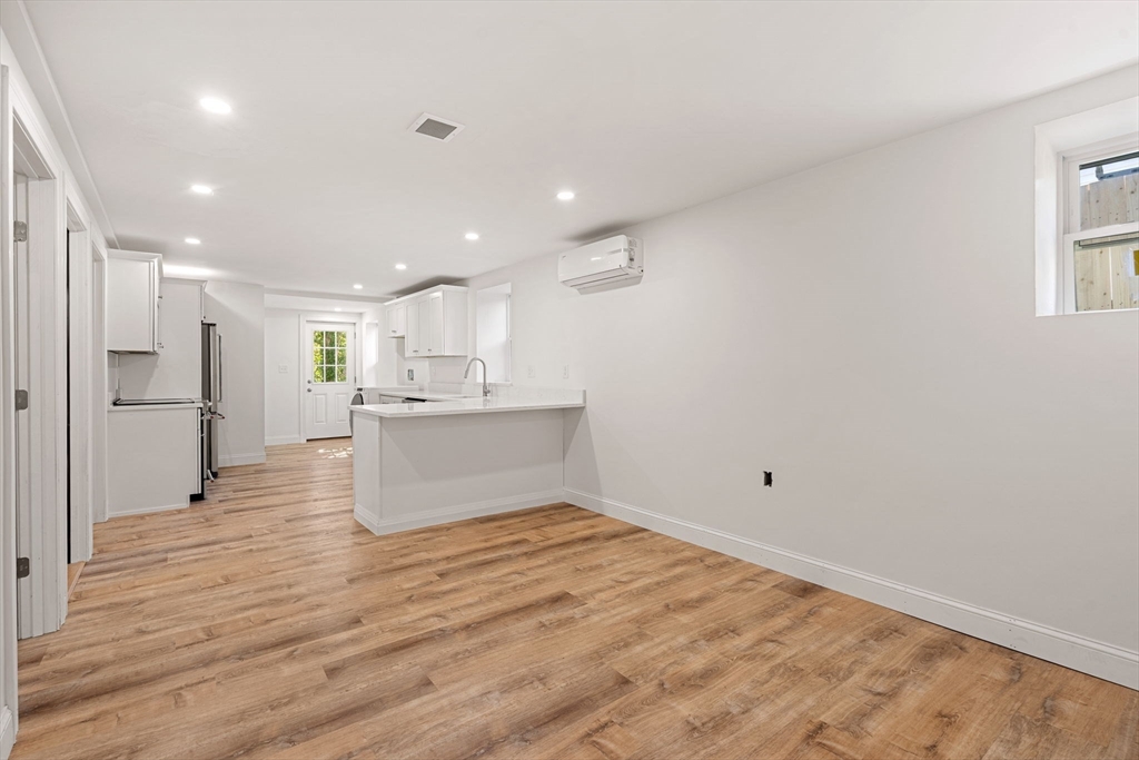29 Willson Street Salem, MA 01970 - Photo 29 of 41 a view of kitchen view wooden floor and window