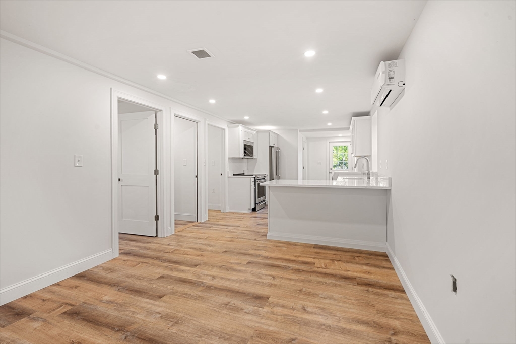 29 Willson Street Salem, MA 01970 - Photo 30 of 41 a view of a kitchen with a refrigerator and a window