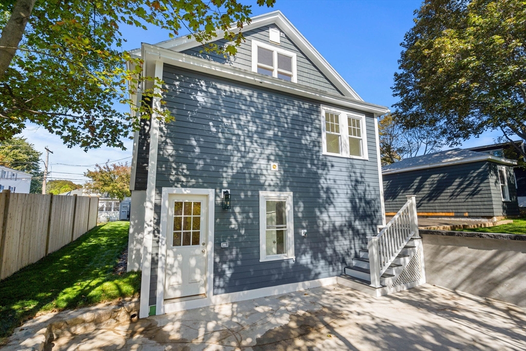 29 Willson Street Salem, MA 01970 - Photo 5 of 41 a front view of a house with a yard
