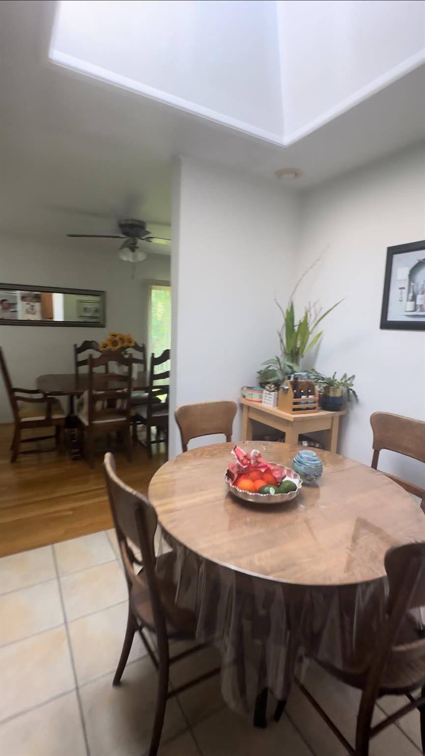 1 Scott Place Plainview, NY 11803 - Photo 4 of 5 a dining room with furniture and wooden floor