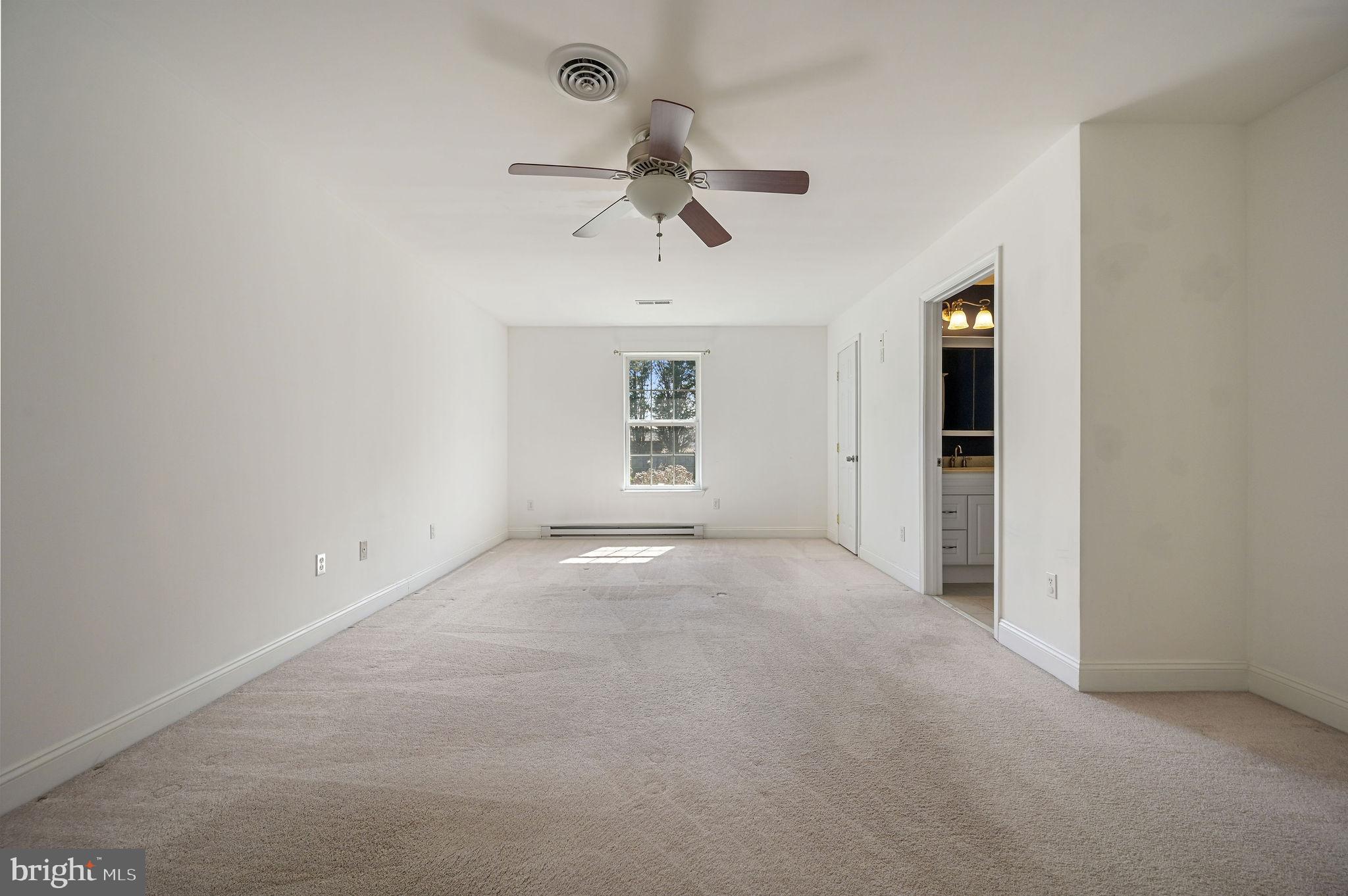 231 East Evens Road Viola, DE 19979 - Photo 17 of 36 an empty room with windows and ceiling fan