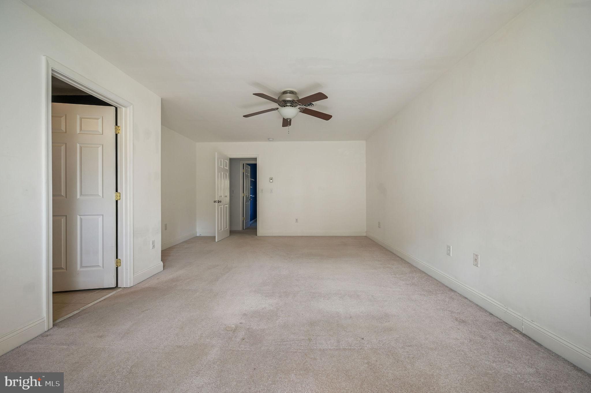 231 East Evens Road Viola, DE 19979 - Photo 18 of 36 an empty room with closet and a ceiling fan