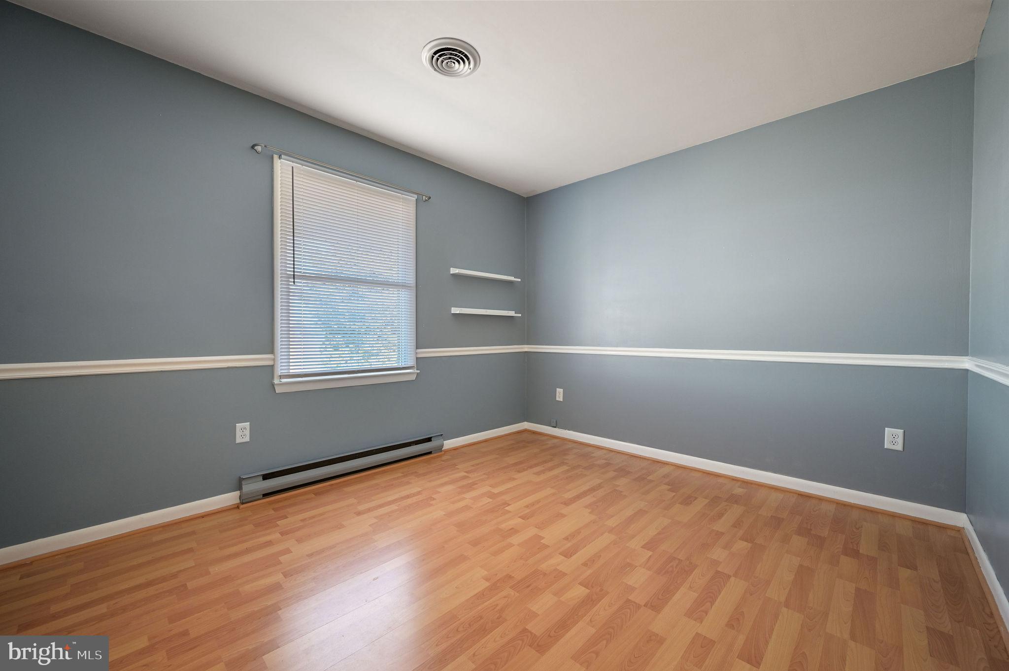 231 East Evens Road Viola, DE 19979 - Photo 20 of 36 wooden floor in an empty room with a window
