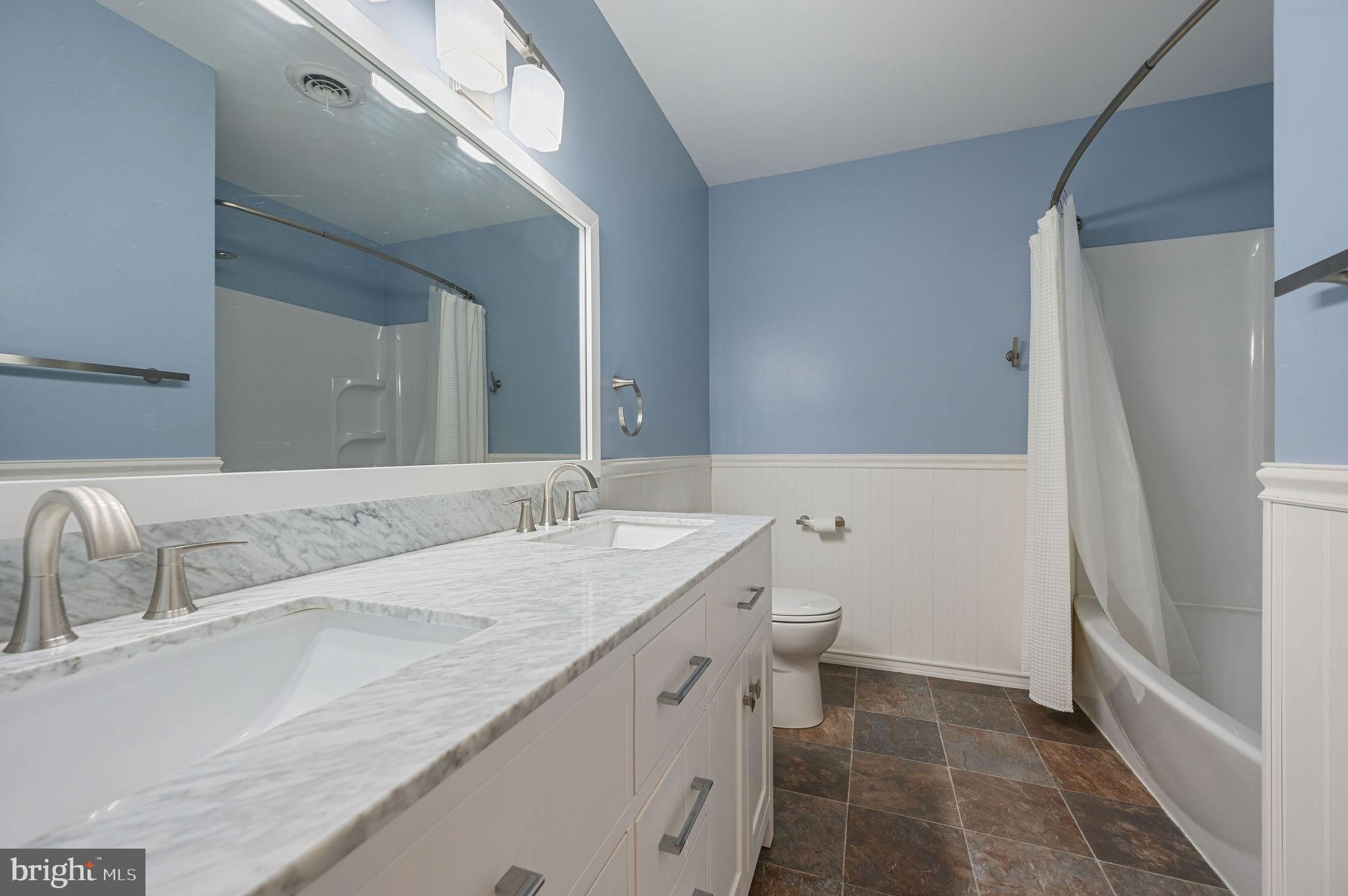 231 East Evens Road Viola, DE 19979 - Photo 22 of 36 a bathroom with a granite countertop sink and a mirror