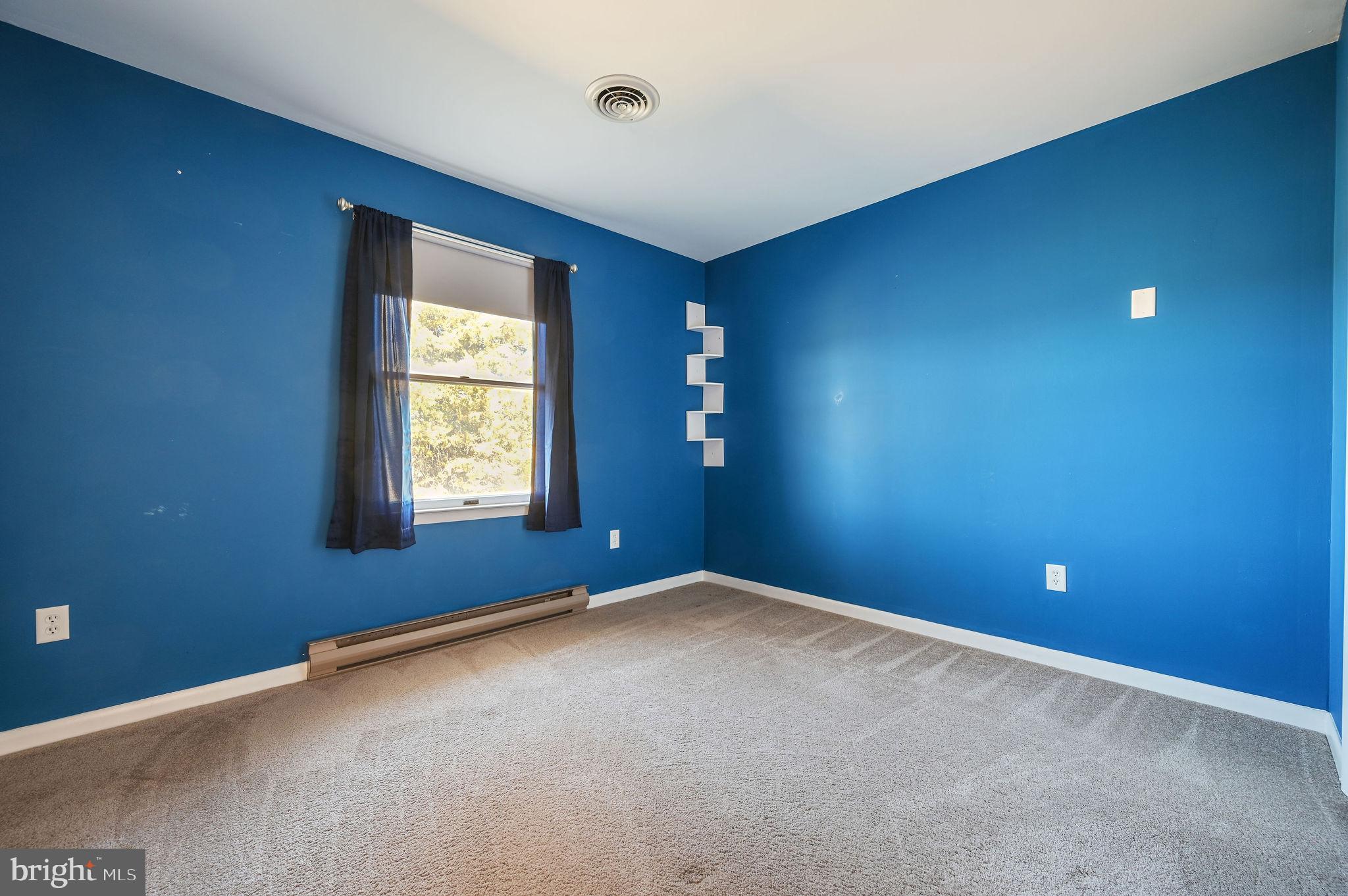 231 East Evens Road Viola, DE 19979 - Photo 23 of 36 an empty room with windows and closet