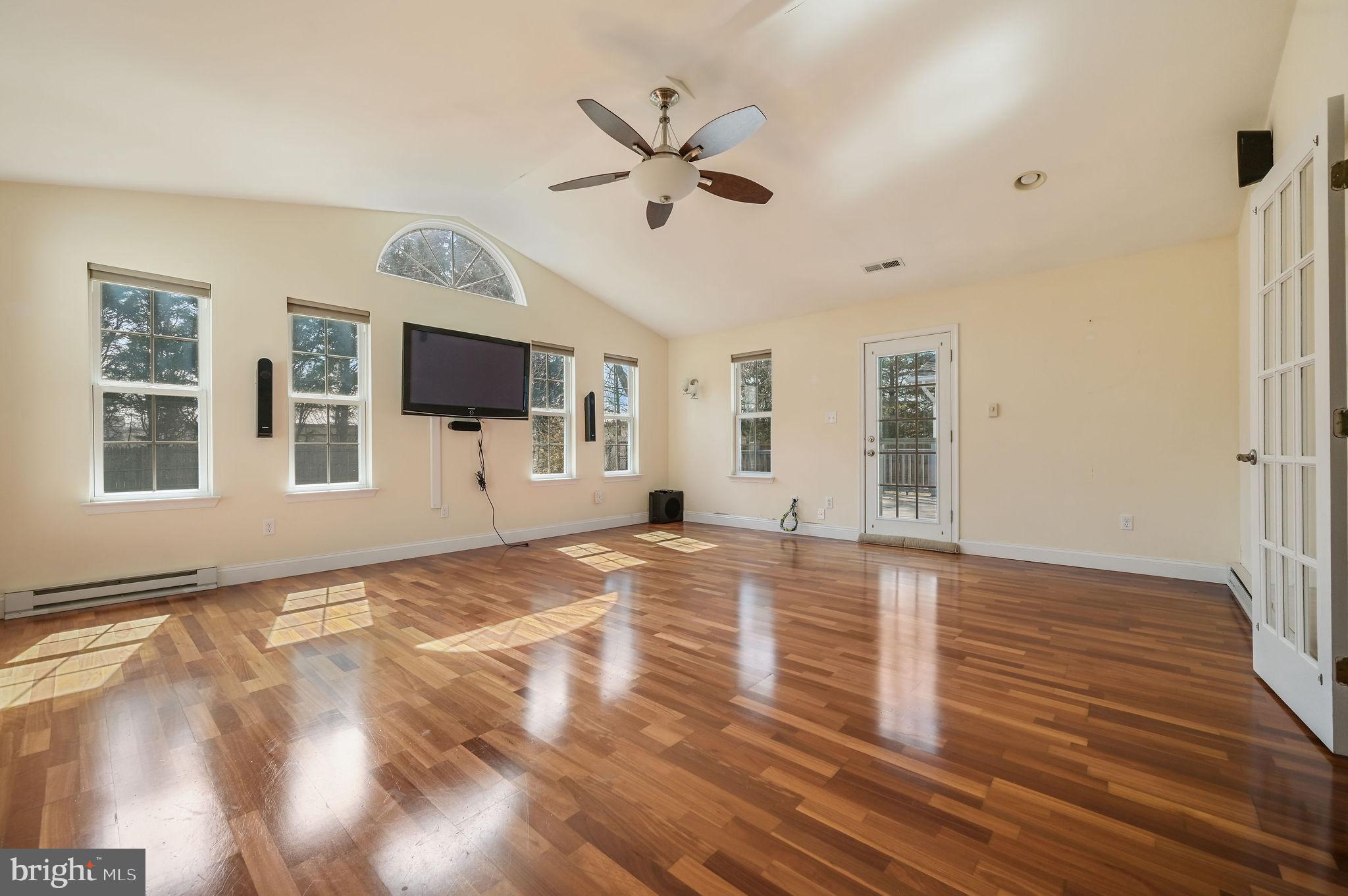 231 East Evens Road Viola, DE 19979 - Photo 5 of 36 a view of a livingroom with wooden floor and a ceiling fan