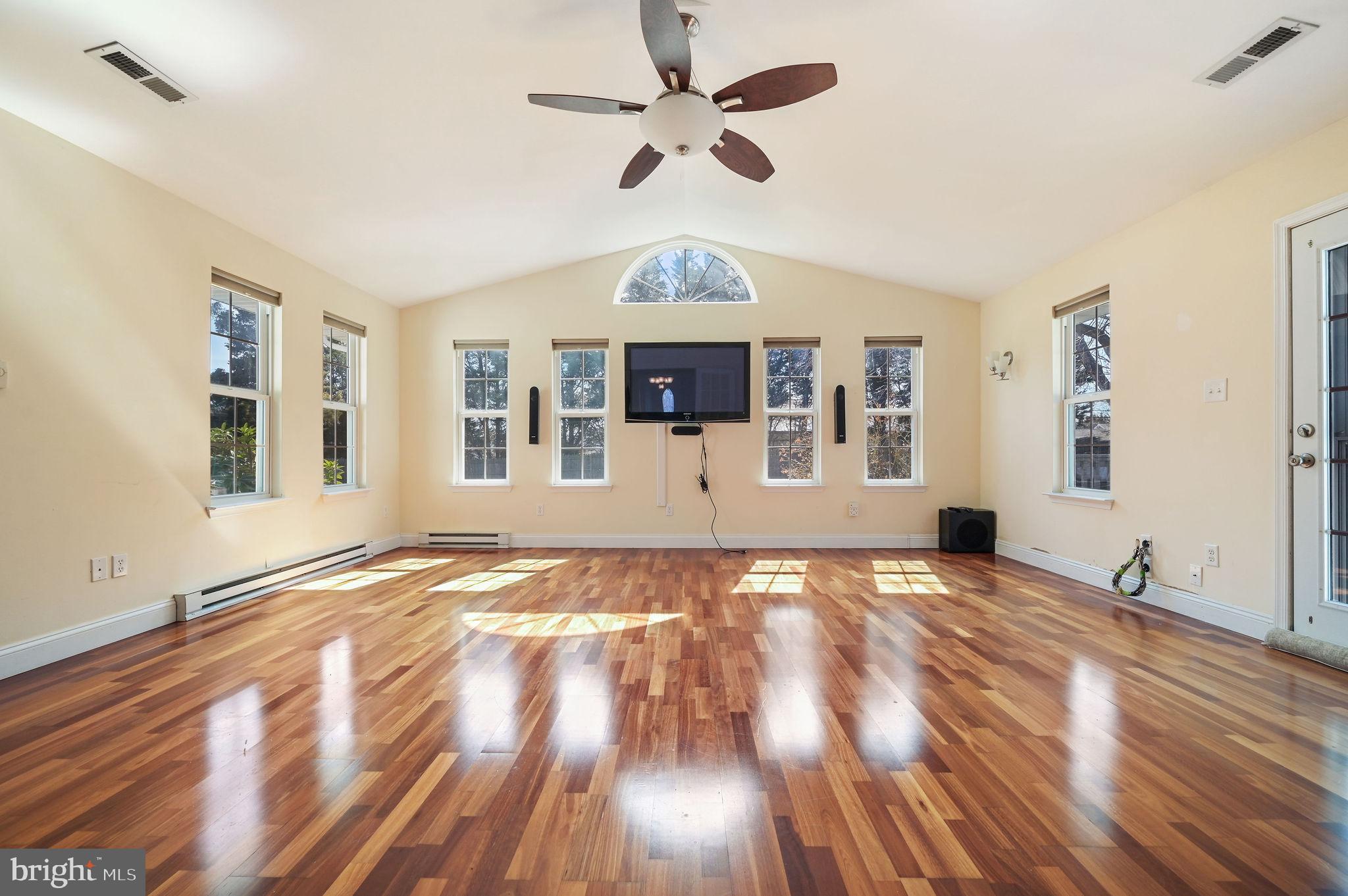 231 East Evens Road Viola, DE 19979 - Photo 6 of 36 a view of an empty room with window and wooden floor