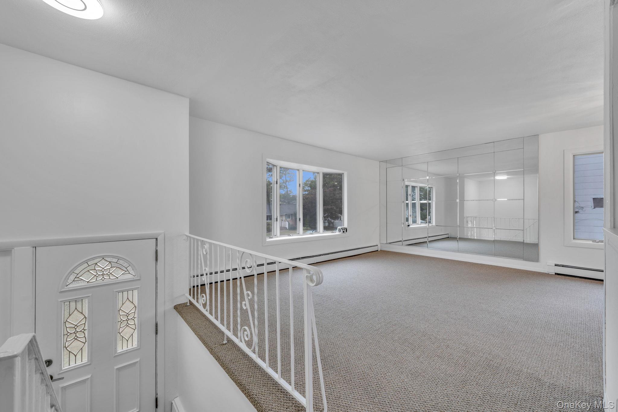 813 Windmill Avenue West Babylon, NY 11704 - Photo 16 of 32 a view of an empty room with chandelier fan