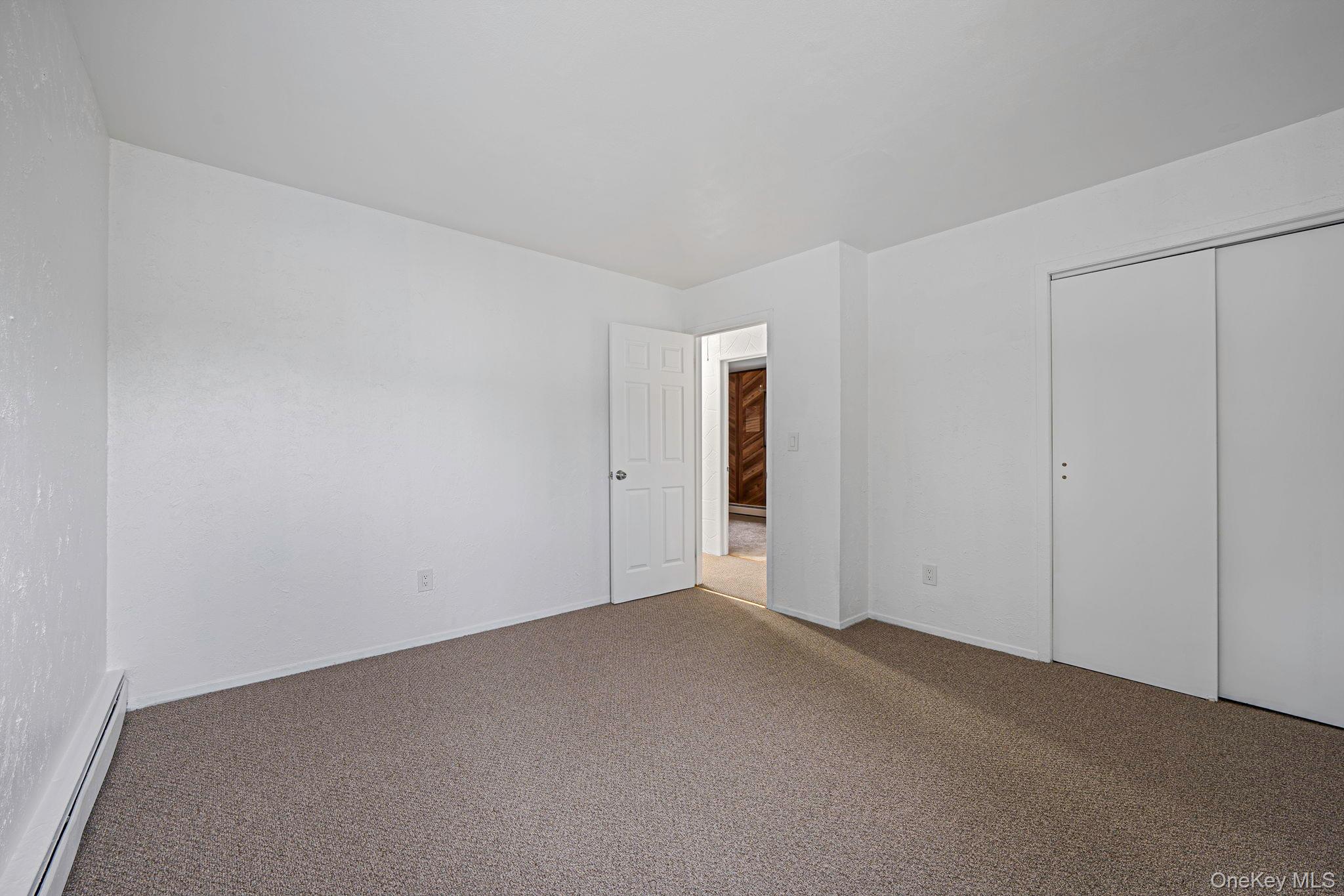 813 Windmill Avenue West Babylon, NY 11704 - Photo 5 of 32 a view of an empty room and entryway