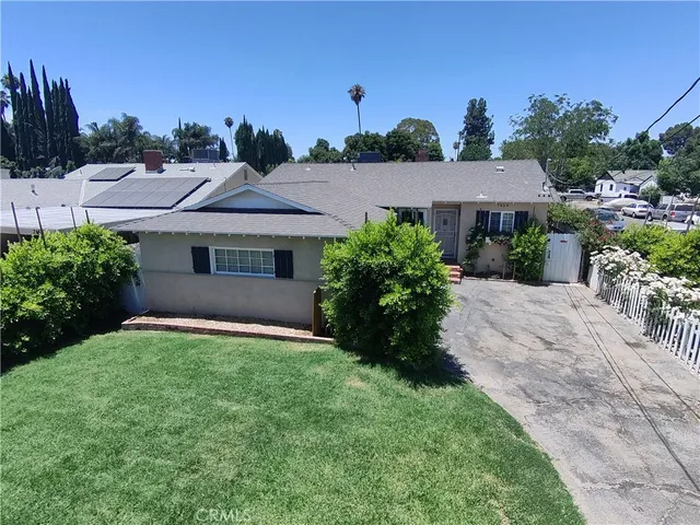 a view of a house with a garden