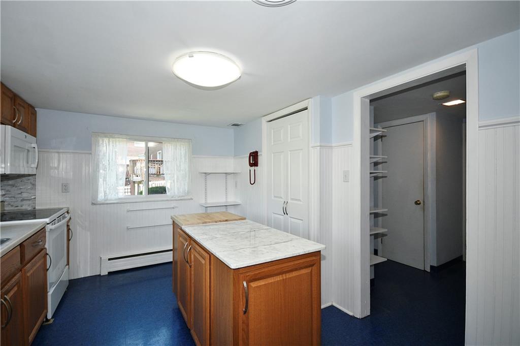 1360 Washington Road Pittsburgh, PA 15228 - Photo 13 of 44 a kitchen with a refrigerator and a stove top oven