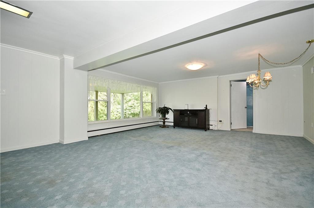 1360 Washington Road Pittsburgh, PA 15228 - Photo 29 of 44 an empty room with a fireplace and windows