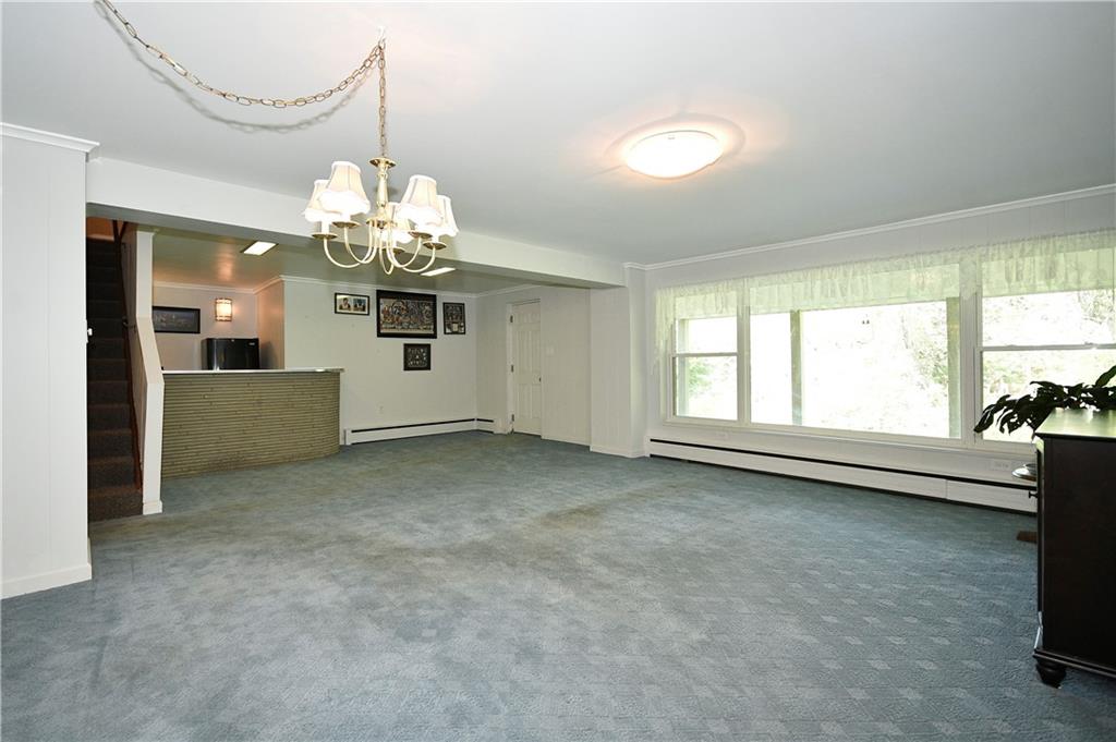 1360 Washington Road Pittsburgh, PA 15228 - Photo 30 of 44 a view of a livingroom with a chandelier