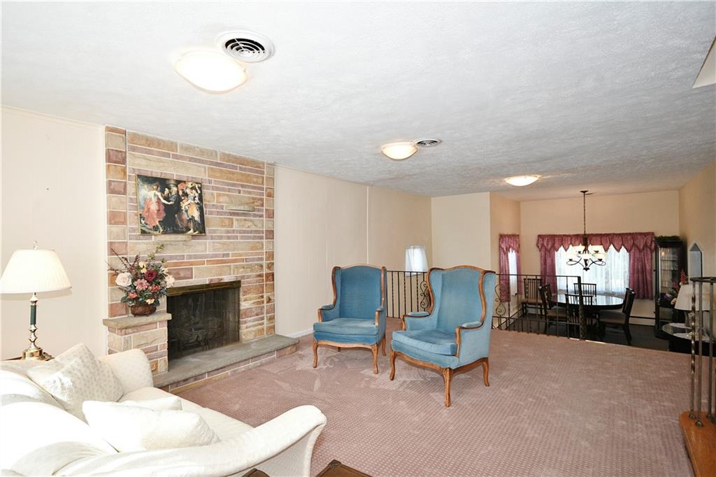 1360 Washington Road Pittsburgh, PA 15228 - Photo 3 of 44 a living room with furniture and a fireplace