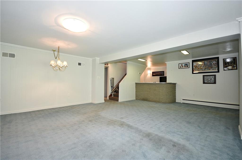 1360 Washington Road Pittsburgh, PA 15228 - Photo 31 of 44 an empty room with chandelier fan and windows