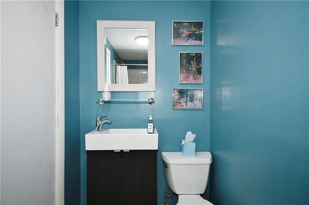 1360 Washington Road Pittsburgh, PA 15228 - Photo 34 of 44 a bathroom with a toilet a sink and mirror