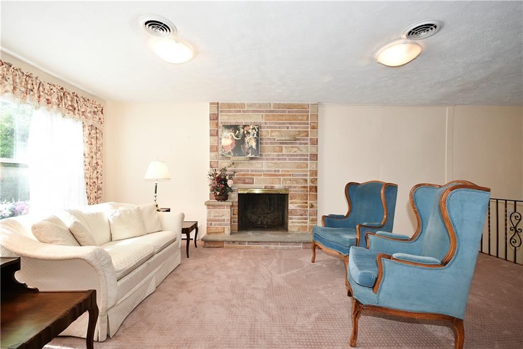 1360 Washington Road Pittsburgh, PA 15228 - Photo 4 of 44 a living room with furniture and a fireplace