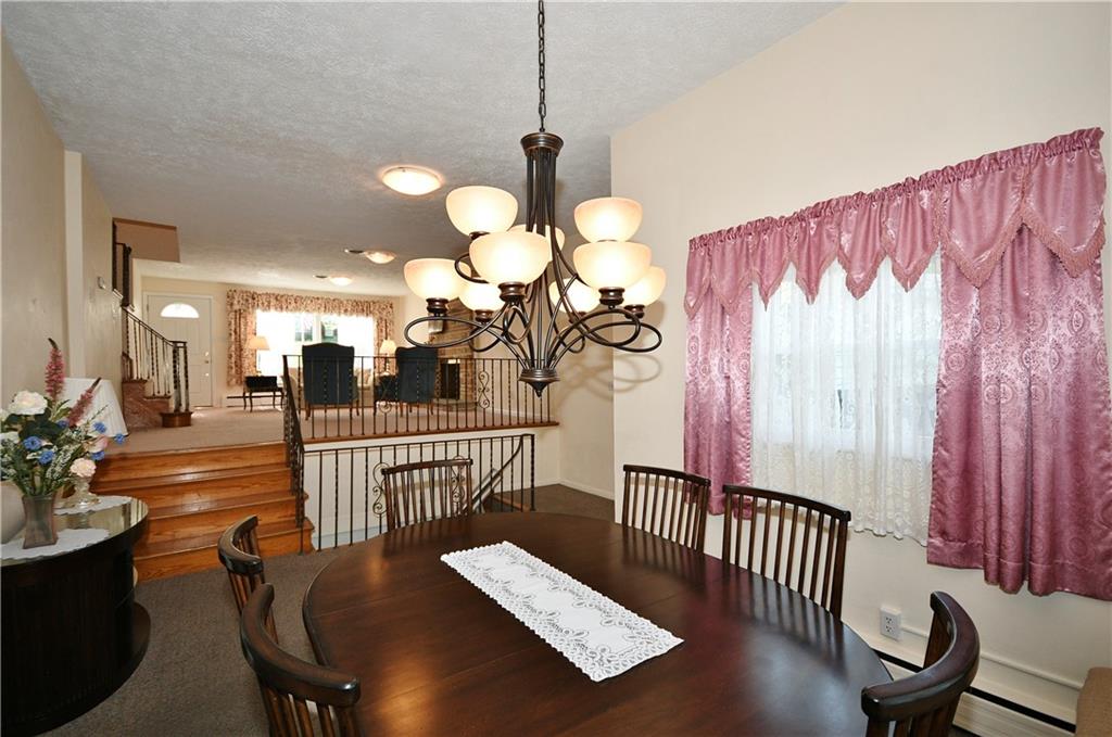 1360 Washington Road Pittsburgh, PA 15228 - Photo 8 of 44 a view of a livingroom with furniture and staircase