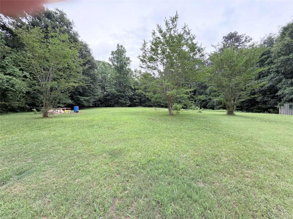 185 Roberts Road Covington, GA 30016 - Photo 23 of 25 a view of field with trees in the background