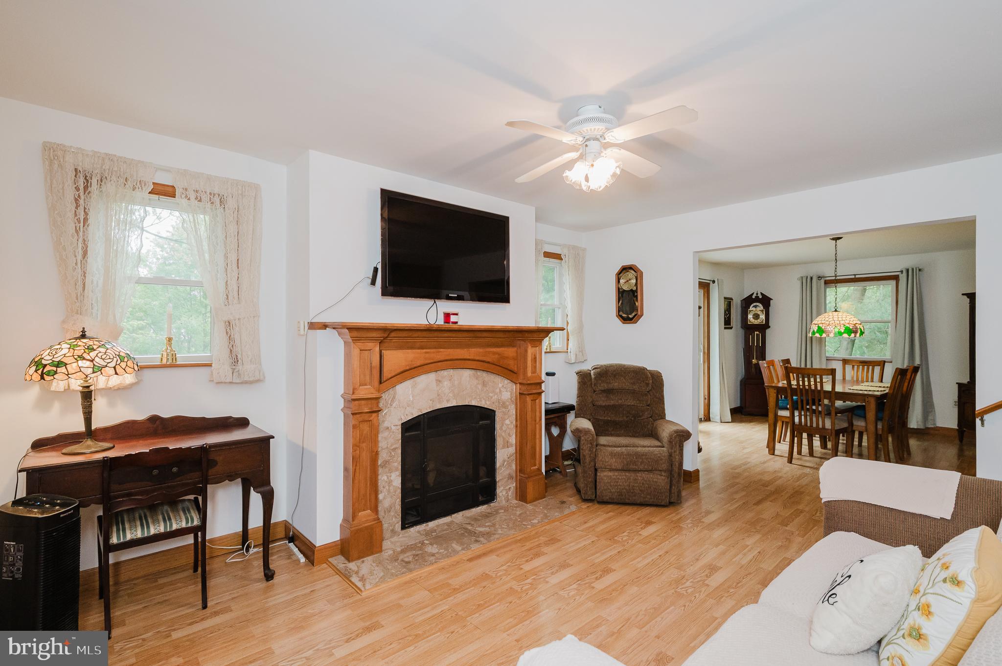 710 Magnolia Road Joppa, MD 21085 - Photo 3 of 58 a living room with furniture a fireplace and a flat screen tv