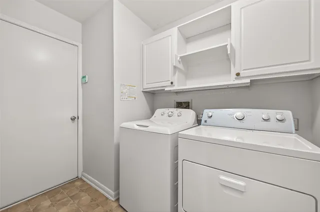 a view of storage and utility room with washer and dryer