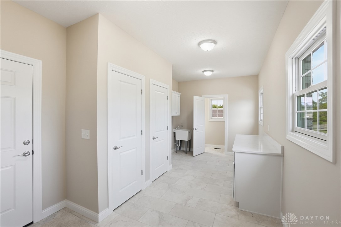 4600 Beal Road Franklin, OH 45005 - Photo 27 of 42 This bright utility room features ample space and functional design for everyday tasks.
