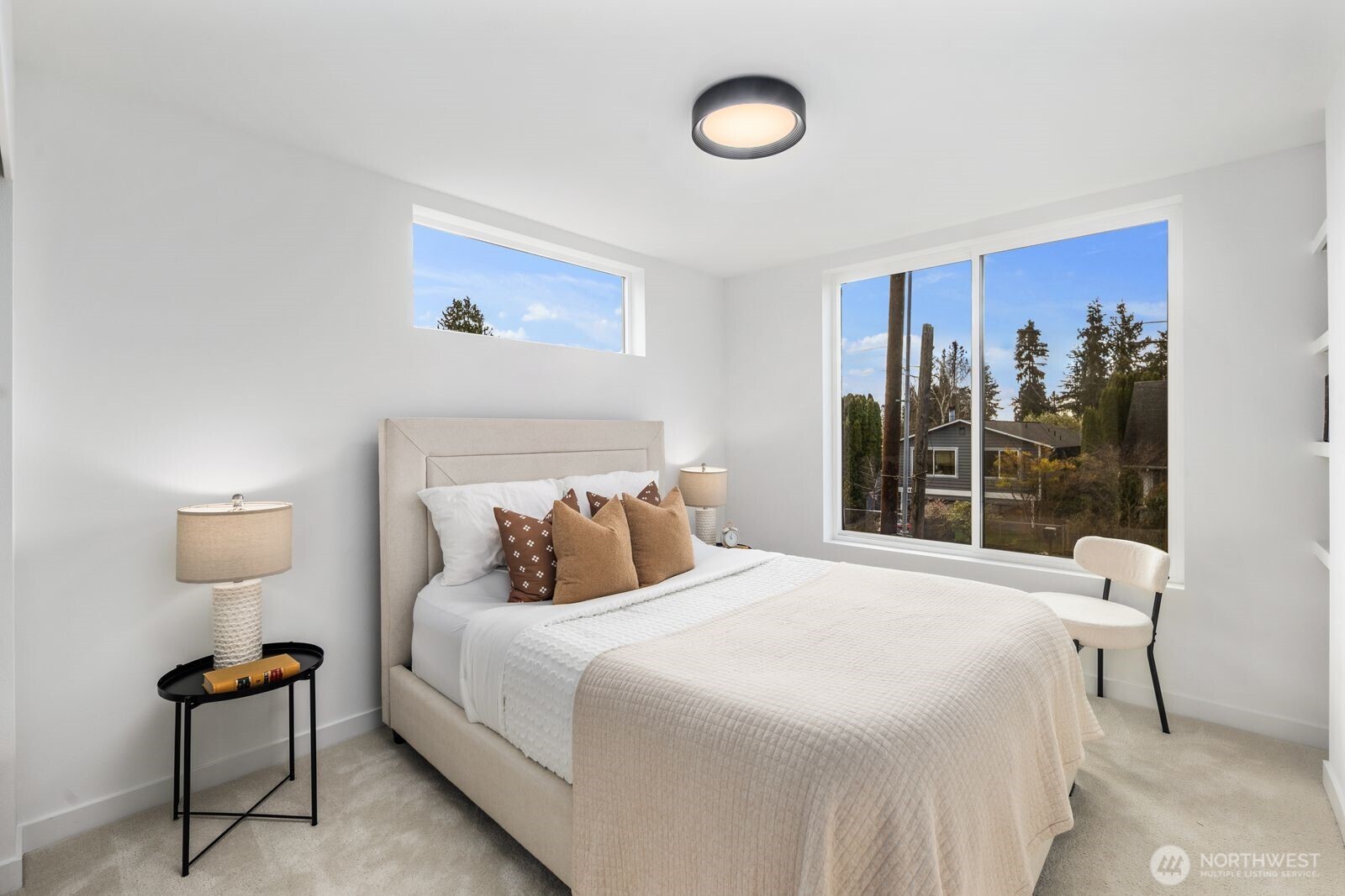 520 North 102nd Street Seattle, WA 98133 - Photo 16 of 20 a bedroom with a bed and a lamp next to a window